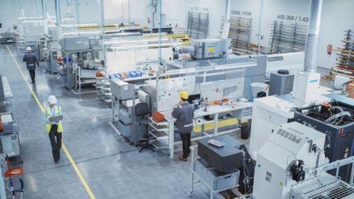 Industrial Factory: Diverse Team of Engineers, Technicians, Professionals and Workers, Working on Production Plant, Optimizing CNC Machinery, Programming Machines, Executing Orders.